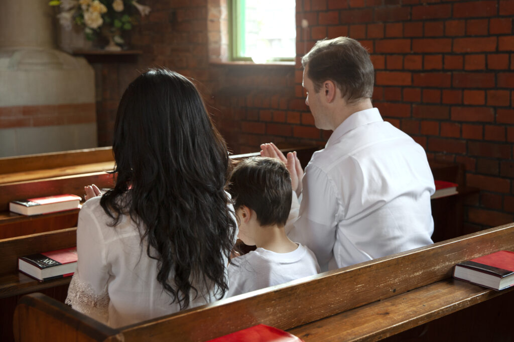 christian family praying church medium shot